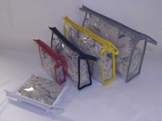 Clear Zipper Bag: All clear stitched cosmetic zipper bag with end loop and coloured trim, ideal for cosmetics,toiletries and perfumes.<br>These are sewn and the coloured trim gives extra strength.